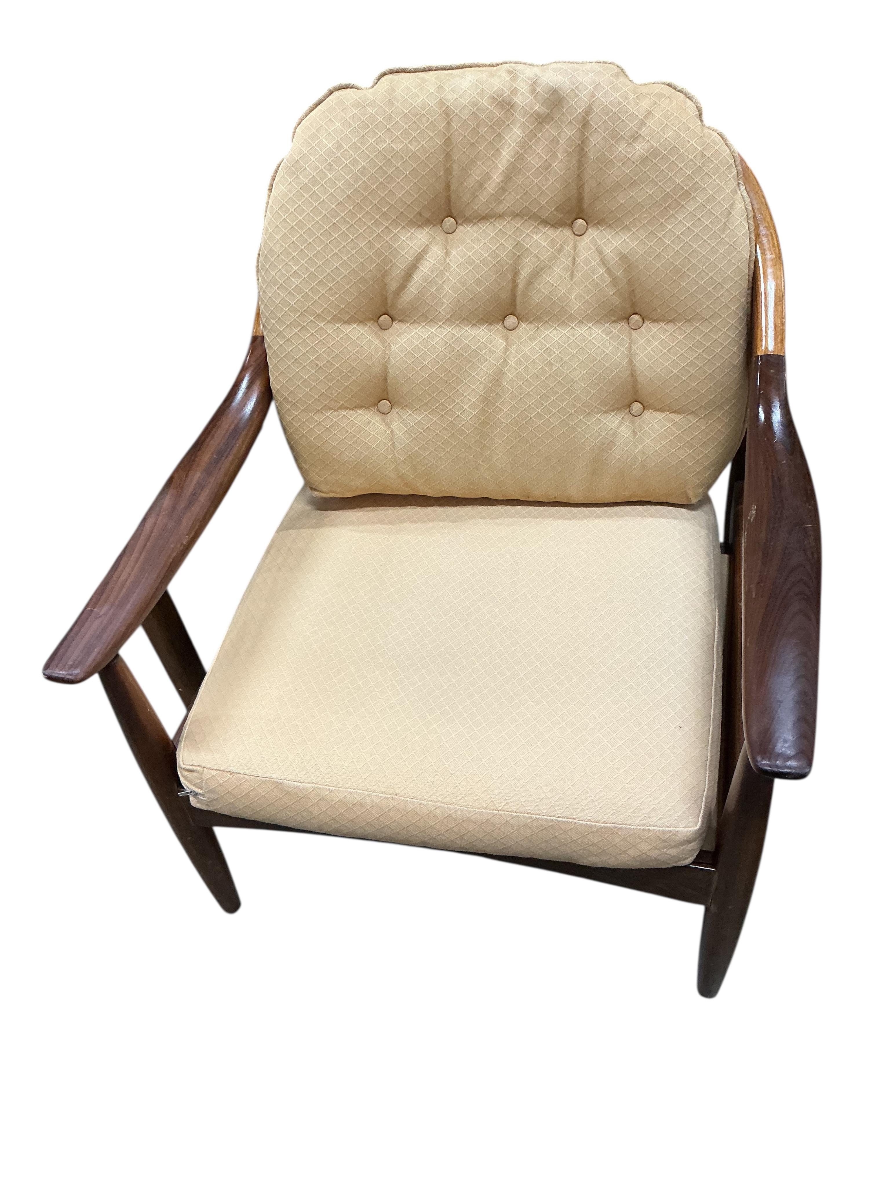 Greaves and Thomas: A pair of mid century teak stick back armchairs, width 62cm, depth 70cm, height 70cm